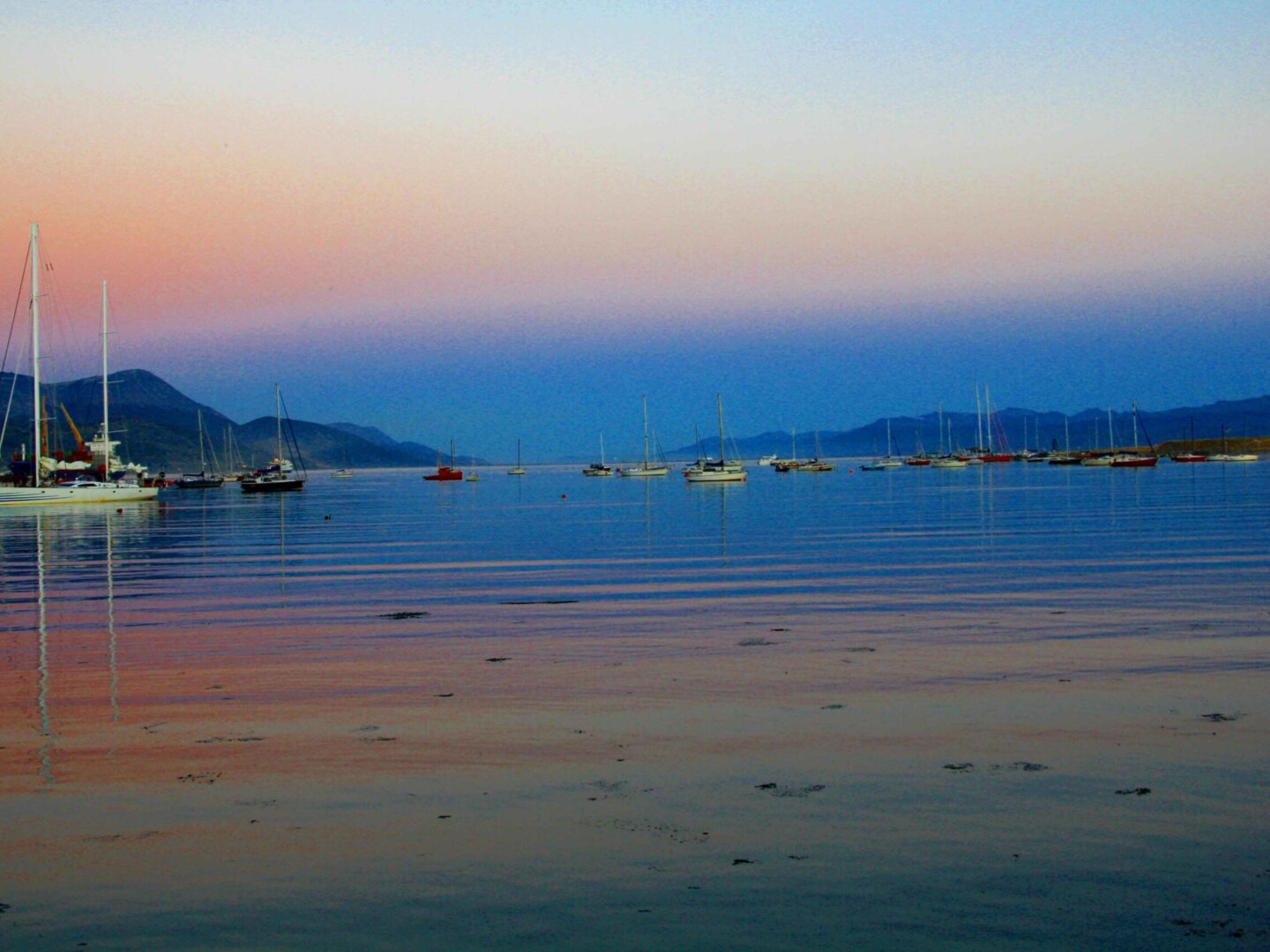 ushuaia boats ocean sunset mirror