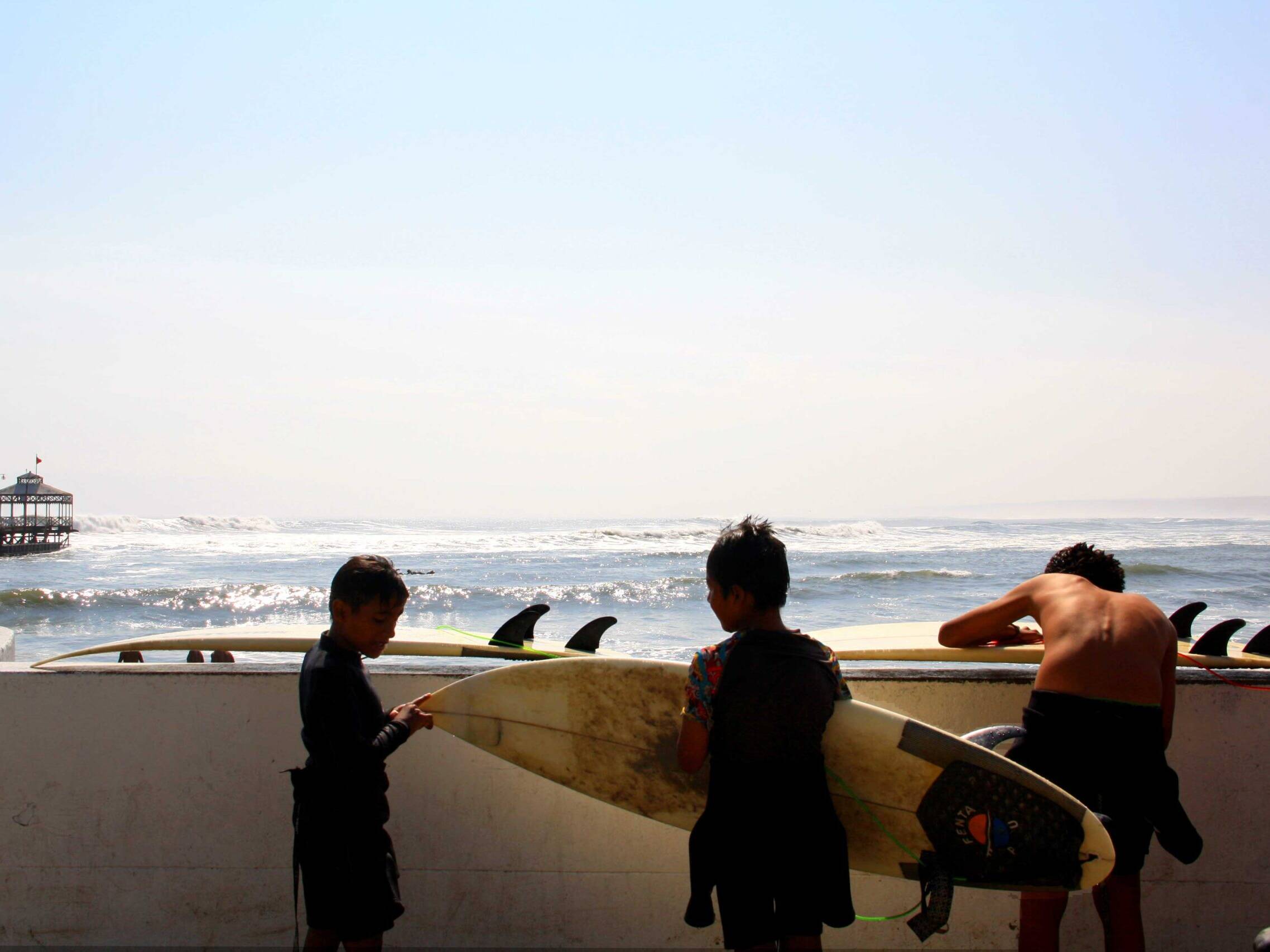 kids surfing surfboards peru