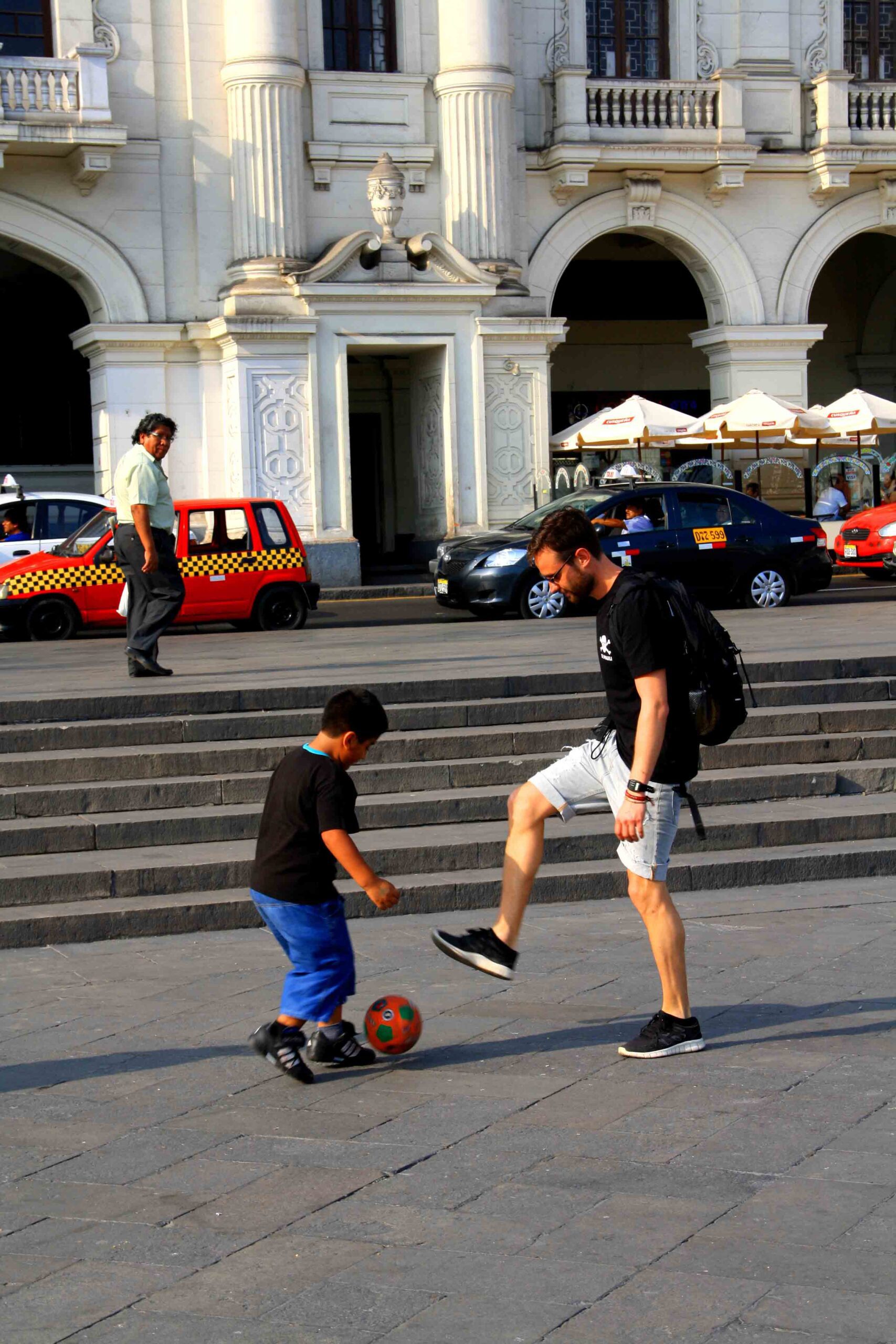 playing soccer in the streets of lima