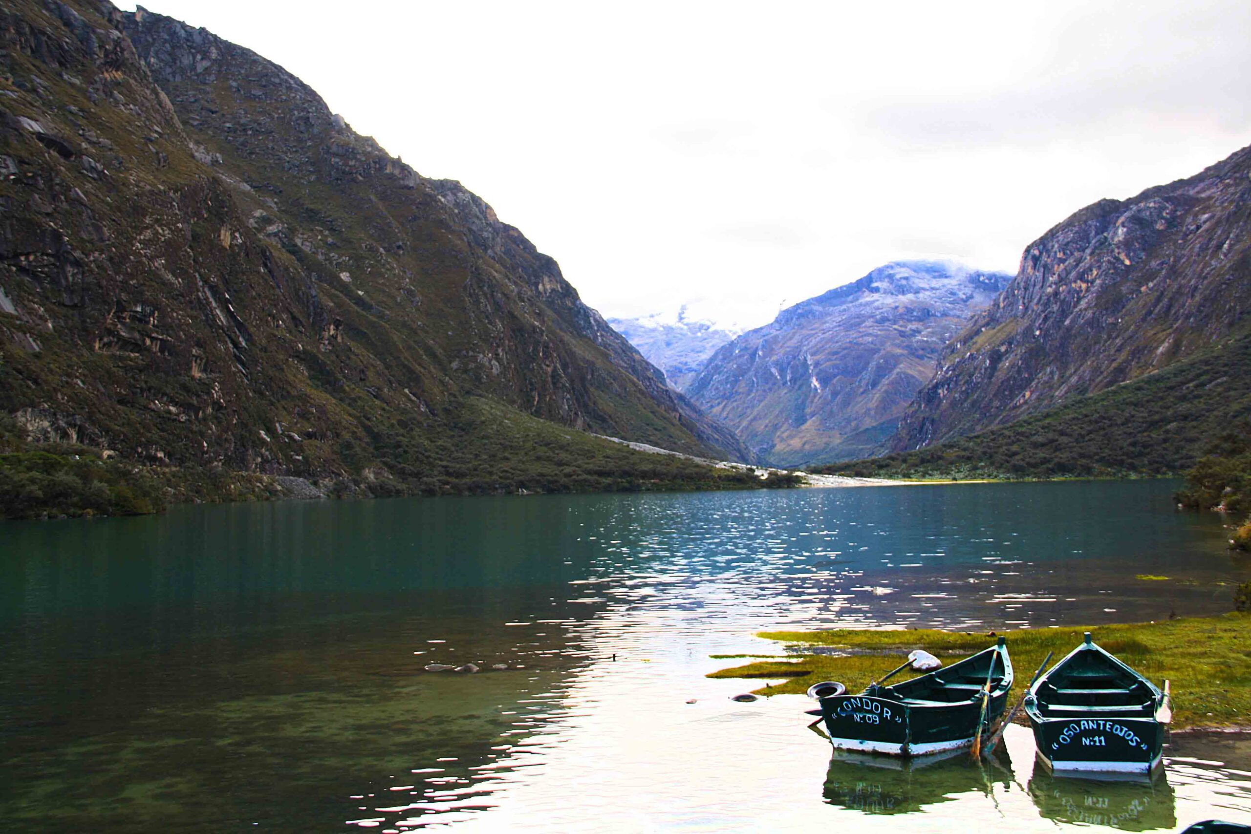 lake view with boats in the cordillera blanca
