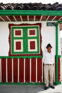 colombian man in front of house salento