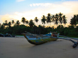 sky sunset talalla beach fisherman boat sri lanka
