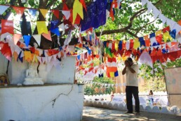 flags praying buddhism natha devale kandy sri lanka