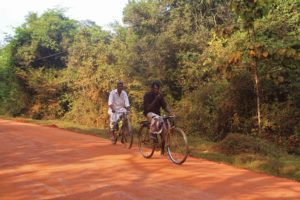 local men cycling sigiriya sri lanka