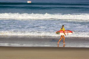 Surfer girl on the beach of Hossegor France