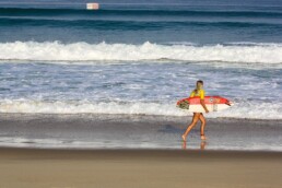Surfer girl on the beach of Hossegor France