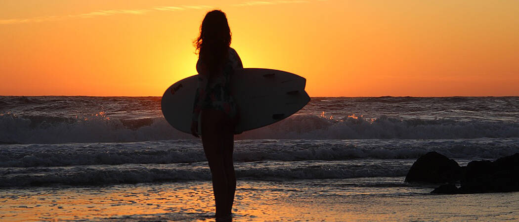 sunset silhouette surfing ocean costa nova portugal
