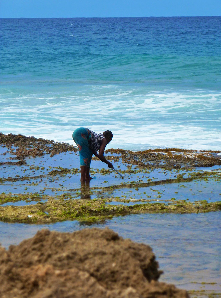 woman fishing ocean ponta do ouro mozambique