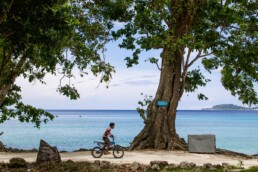 Boy on a bicycle on Gapang beach Pulau Weh
