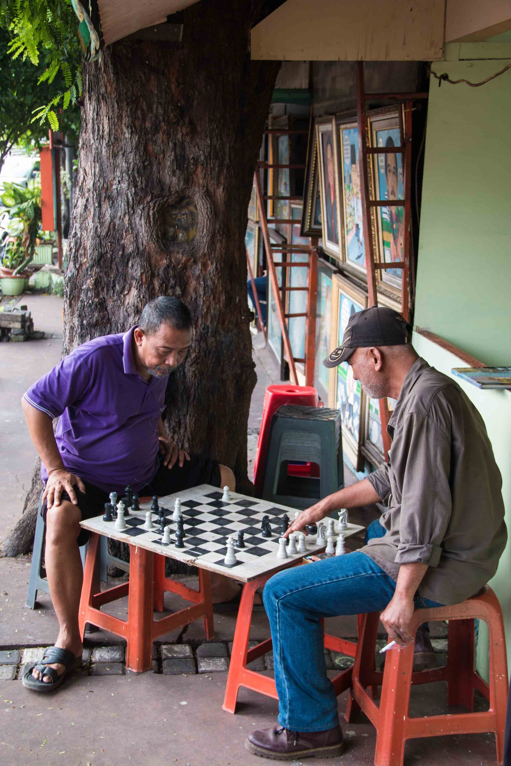 Men playing chess on the streets of Jakarta Indonesia