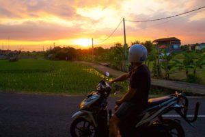 scooter canggu rice fields sunset bali