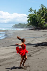 Dancing girl on the beach in Costa Rica