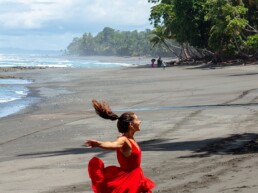 Dancing girl on the beach in Costa Rica