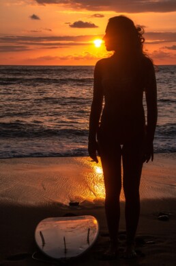 Surfer girl during sunset in Punta Banco Costa Rica