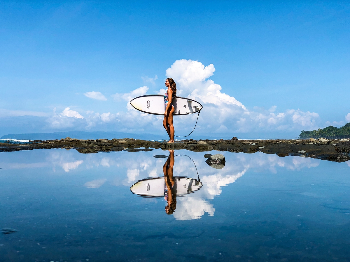Reflection surfer girl in Punta Banco Costa Rica