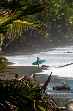 Surfer girl on Punta Banco beach in Costa Rica