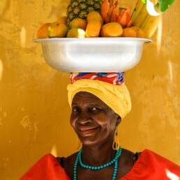 Woman with fruit basket in Cartagena Colombia