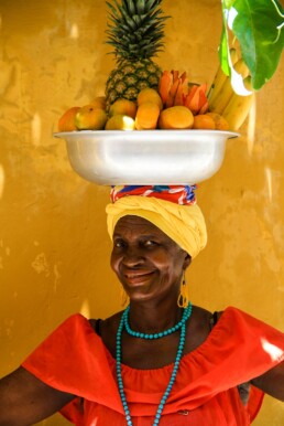 Woman with fruit basket in Cartagena Colombia