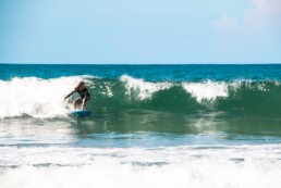 Surfer at Playa Cocles in the Caribbean Costa Rica