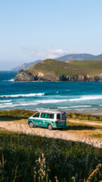 Roadsurfer van during surf road trip at Playa Pantin in Galicia