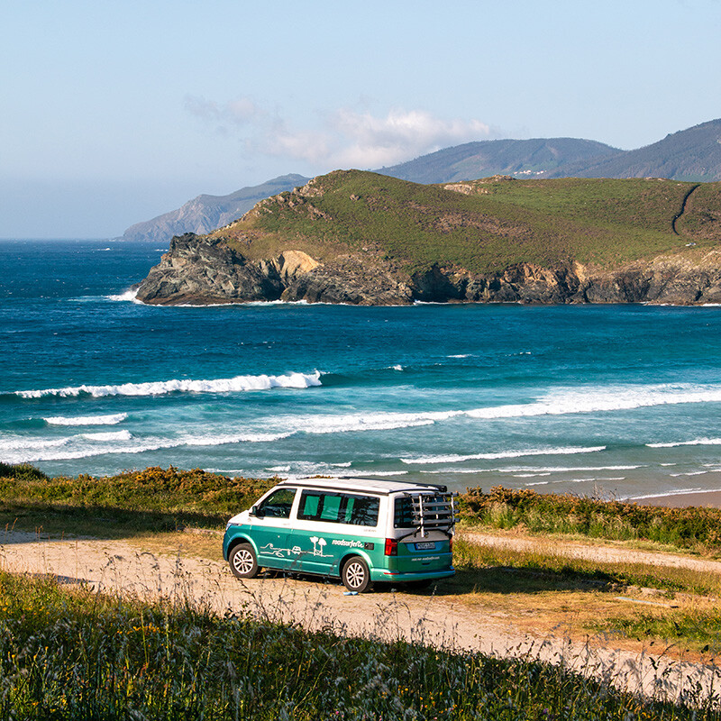 Roadsurfer van during surf road trip at Playa Pantin in Galicia