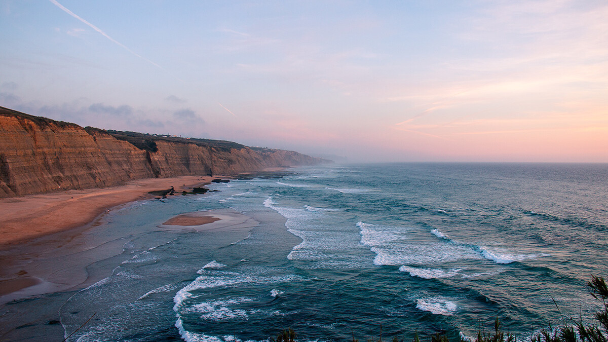 Sunset over Praia Magoito Portugal