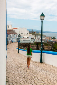 Girl walking in Ericeira old town