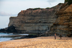 Surfers at Praia Sao Lourenco in Ericeira