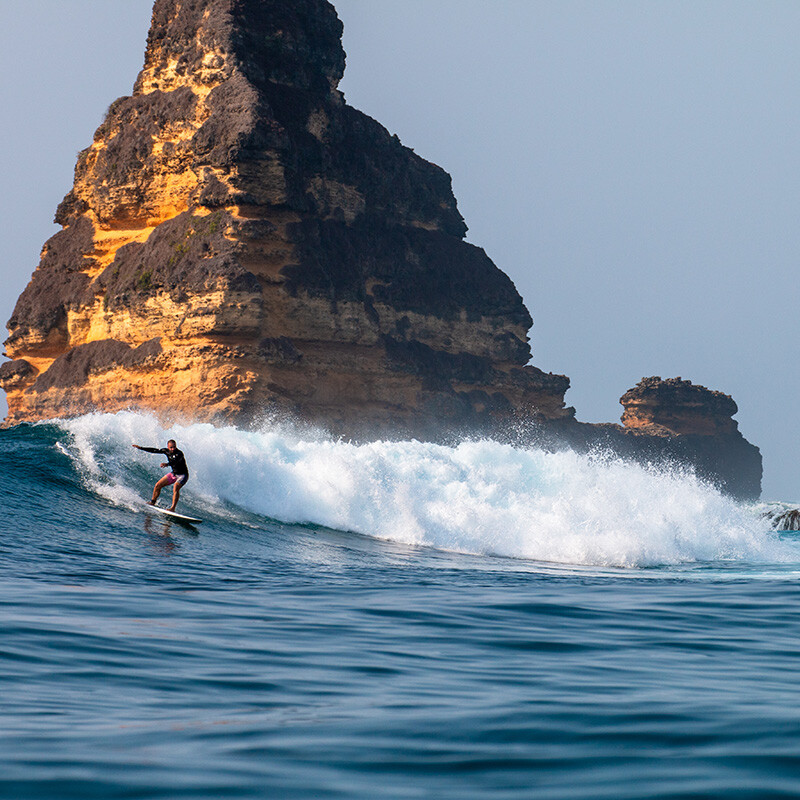 Surfer at Gerupuk Outside wave in Lombok