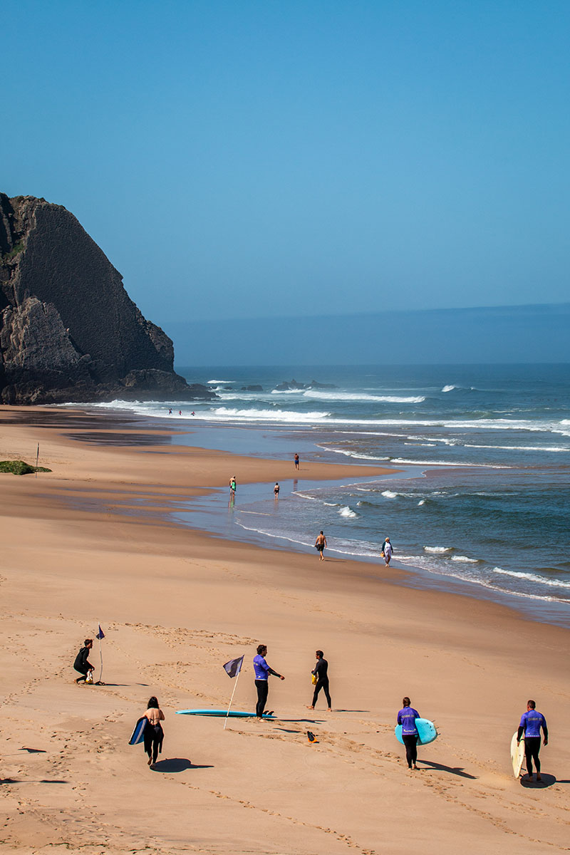 Surfers at Praia Grande beach on the Sintra coast near Lisbon
